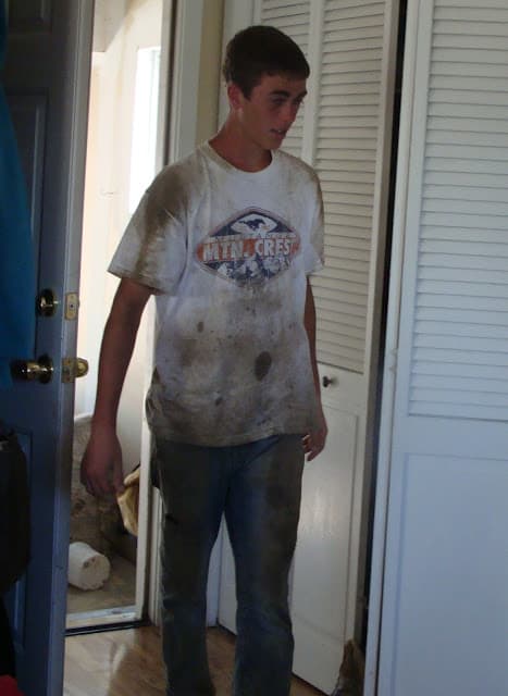 The founder at fifteen, covered in concrete on a footing crew